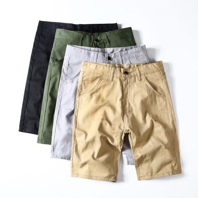 Shorts d'entraînement pour hommes en tissu de polyester avec un design de couleur simple et solide