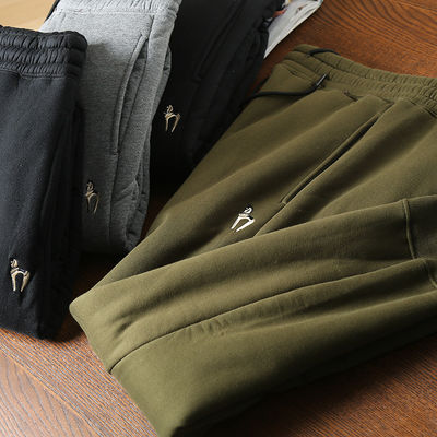 100% de coton brodé en laine d'homme en doublure de laine des coureurs des pantalons chauds rembourrés des pantalons pour la taille moyenne