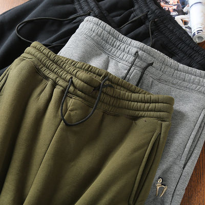 100% de coton brodé en laine d'homme en doublure de laine des coureurs des pantalons chauds rembourrés des pantalons pour la taille moyenne